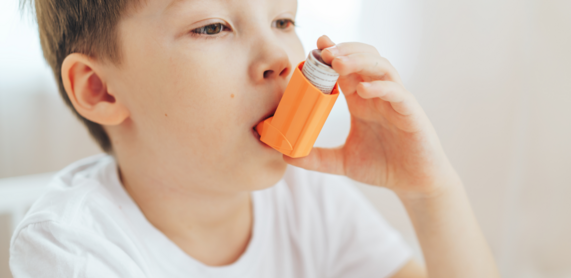 Young child using an inhaler