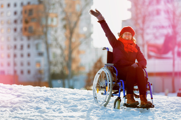 Woman in wheelchair in the snow