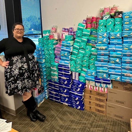 Sarah with all the period product donations