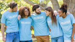 Group of volunteers having fun in a park