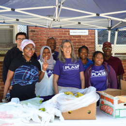 Project PLASE staff and volunteers at their monthly community food drop