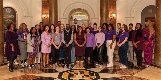 Baltimore City employees wear purple to recognize Domestic Violence Awareness Month