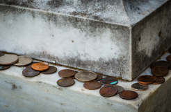 Gravestone with coins