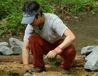 Picture of volunteer working to improve trail