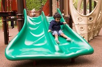 Photo of child on slide