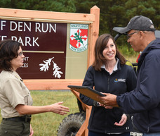 Photo of secretary at grand opening of Wolf Den Run State Park
