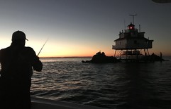 Photo of angler fishing near Thomas Point Lighthouse