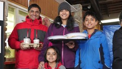 Photo of family with plates of pancakes at Maple Syrup Festival