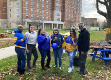 Photo of group of women gathering to plant a tree