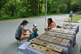 An employee interacting with a parent and child