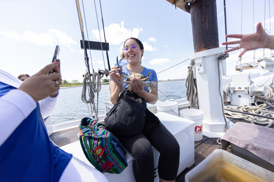 Woman holds crab national aquarium