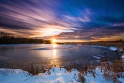 Sunset over a lake during winter
