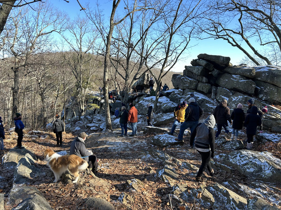 People hiking on a snowy hill