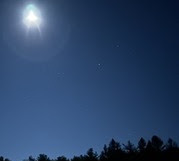 Full moon in a corner of the night sky