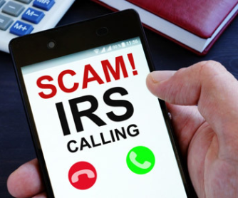 Image of a phone with the words IRS Calling? displayed on the screen