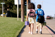 Children walking on the sidewalk