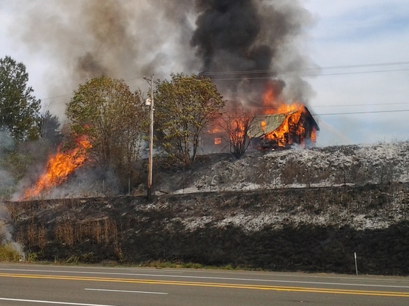 Brush Fire Spreads to Structure