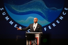 Governor Moore speaking at podium