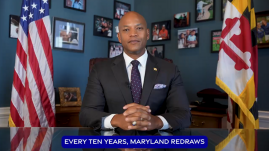 Governor Wes Moore seated at desk