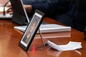 A framed photo of Mason Kearns sits on a table in the Senate Education, Energy, and the  Environment Committee.