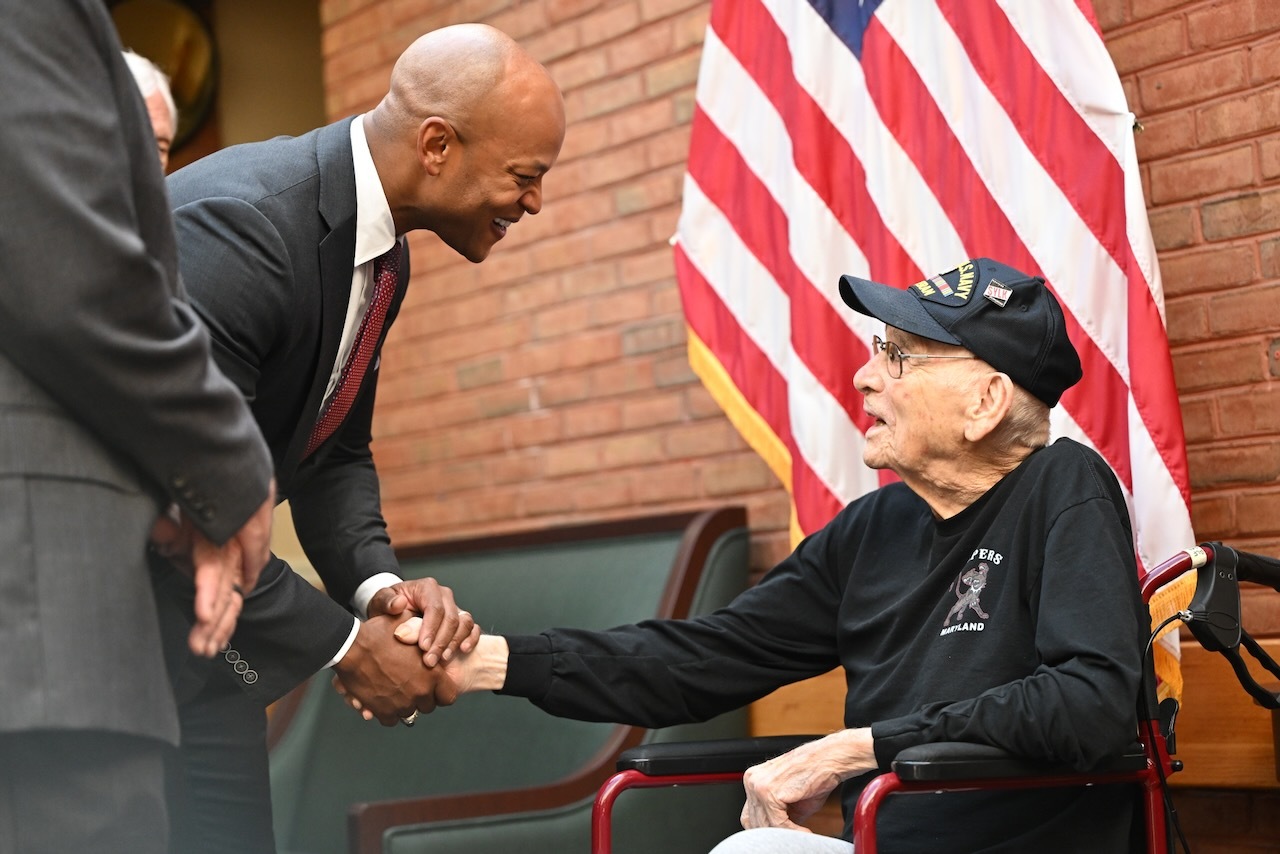 Governor Moore shaking hands with WWII Veteran Clayton Bump