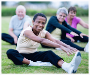 older adults stretching outdoors