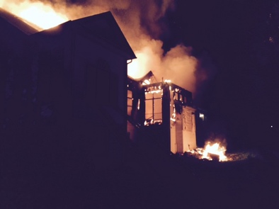 photo of flames coming from home