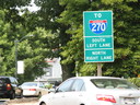 1-270 sign next to a car parked in the street