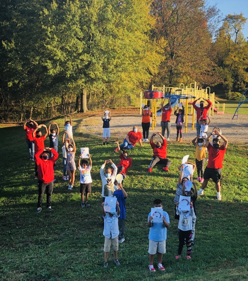 Excel Beyond the Bell youth and providers on a playground