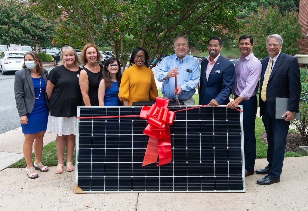 County Leaders posing with solar panel at Paddington Square Celebration Event
