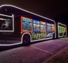 Three holiday-decorated Flash Buses
