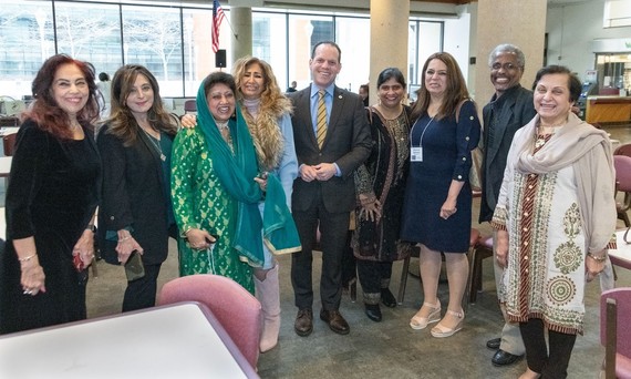 Council President Glass poses with residents at an event celebrating Ramadan.