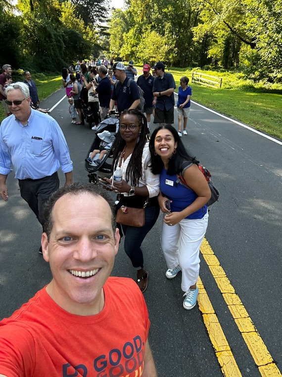 Council President Glass poses for a selfie with Councilmember Fani-González and community members for the walk for democracy.