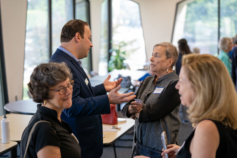 Council President Friedson speaks with a resident at a meet and greet with members of the Villages.