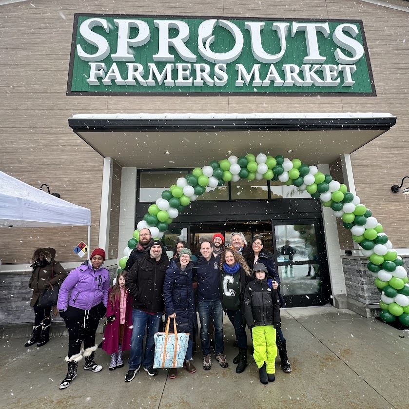 Councilmember Glass with Burtonsville community members celebrating the Sprouts opening.