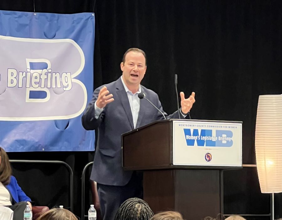 Council President Friedson speaks at a podium at the Women’s Legislative Briefing.