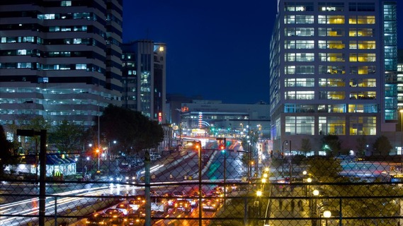A photograph of a busy street at night in one of our downtown business centers