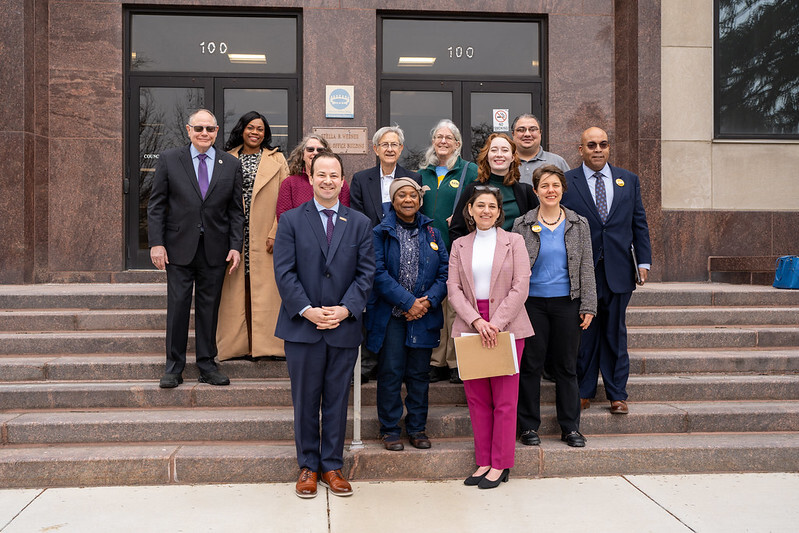 CP Friedson and VP Stewart pose for a group photo on the Council front steps with Councilmembers and community members supporting the FAITH ZTA.