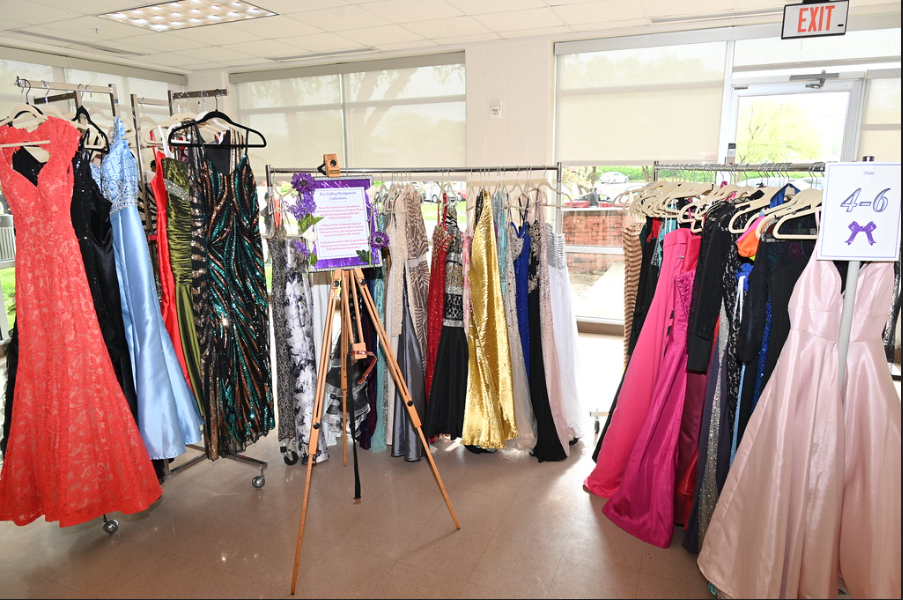 A picture from last year's Project Prom Dress event showing several racks of prom dresses