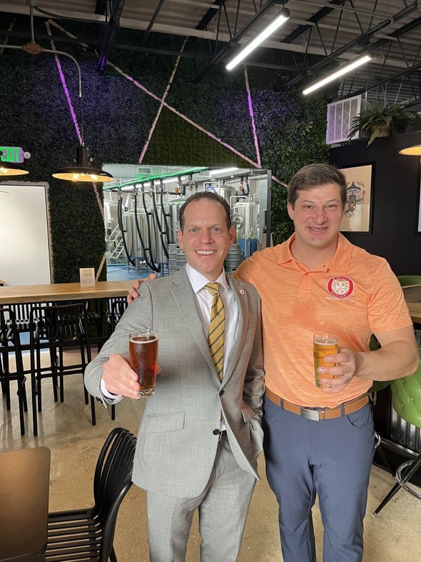 Councilmember Glass and a resident at one of our local breweries