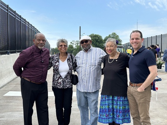 A photo of Councilmember Glass with residents of the Lyttonsville community