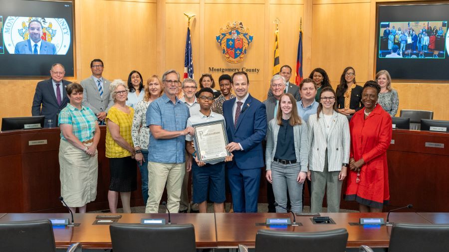 Group photo in the Council chamber with Councilmembers and the Montgomery History team.