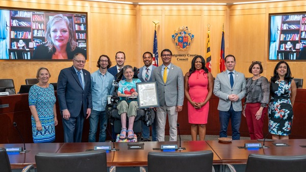 Councilmember Luedtke presents a proclamation for Mattie Stepanek Peace Day. 