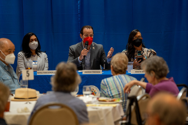 Council President Friedson speaks at a table with Councilmembers to Leisure World residents.