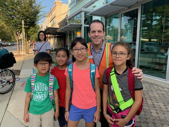 A photo of Councilmember Glass with elementary school safety patrols