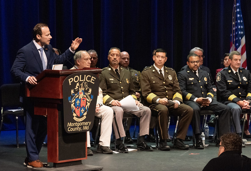 CP Friedson speaks at MCPD-branded podium at the Police Academy graduation.