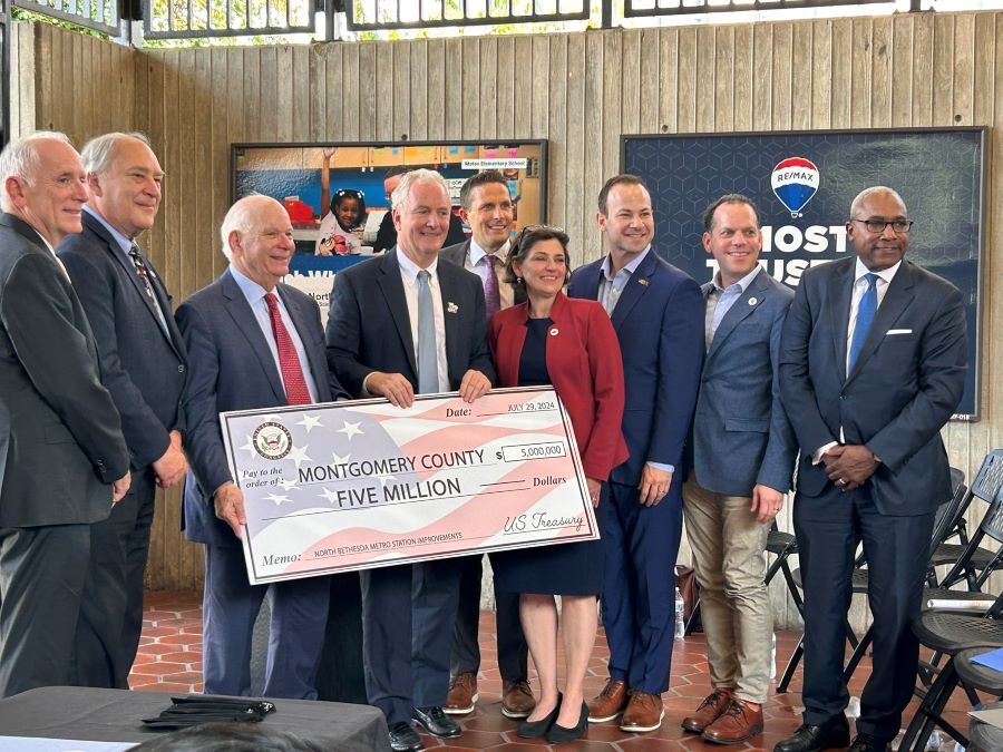 Federal, County and WMATA leaders hold a $5 million check addressed to Montgomery County.