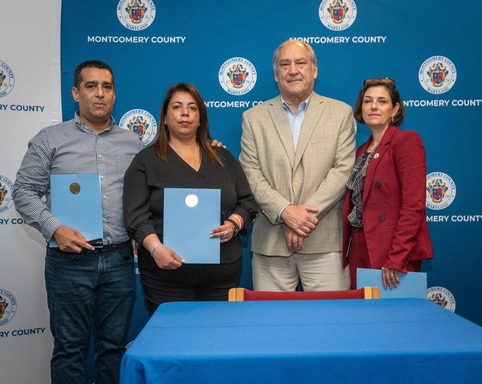 Melanie's parents with CVP Stewart and CE Elrich at the bill signing