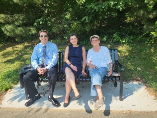 CVP Stewart and resident sitting on new bench near Tilden Woods