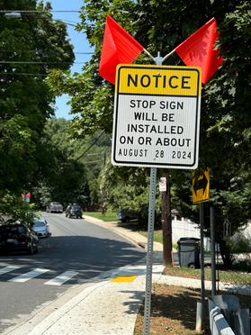 Sign announcing all-way stop for intersection of Hartford Ave & Silver Spring Ave